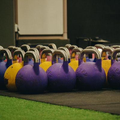 Minimalist kettlebell on a concrete floor surface